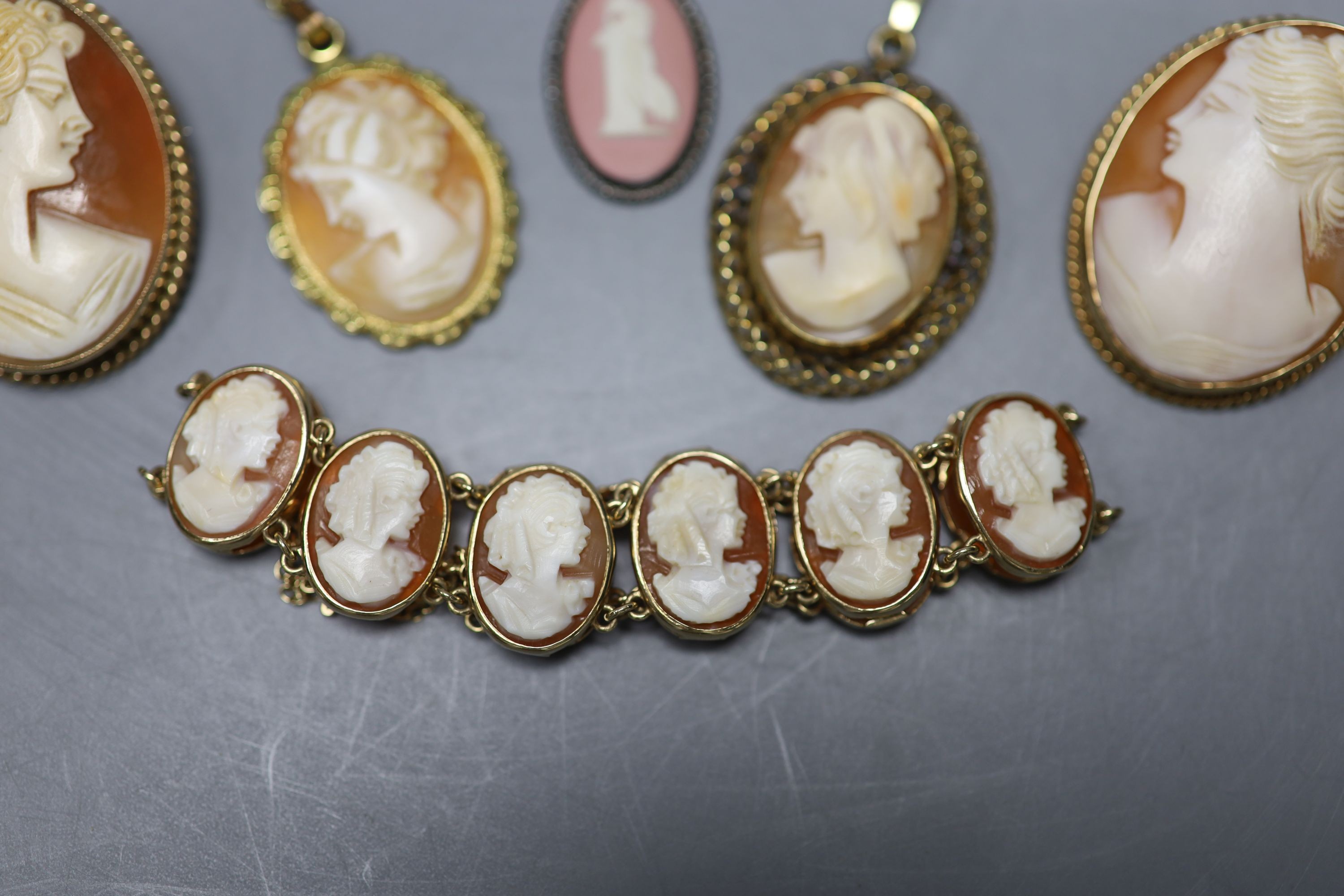 A modern 9ct gold and oval cameo shell bracelet, 16cm, two 9ct mounted cameo shell brooches, a pair of 9ct gold and cameo shell earrings and seven other items, 9ct gross 31.4 grams.